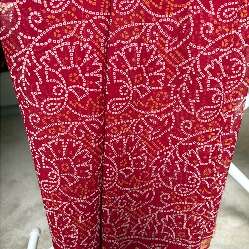 Red Chiffon/ georgette tie dye sari. Gold border